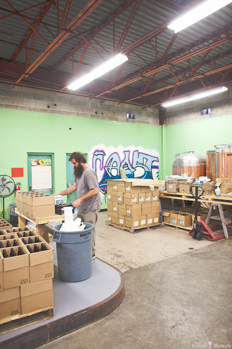 COAST Brewer/Owner, David Merritt Labeling Bottles